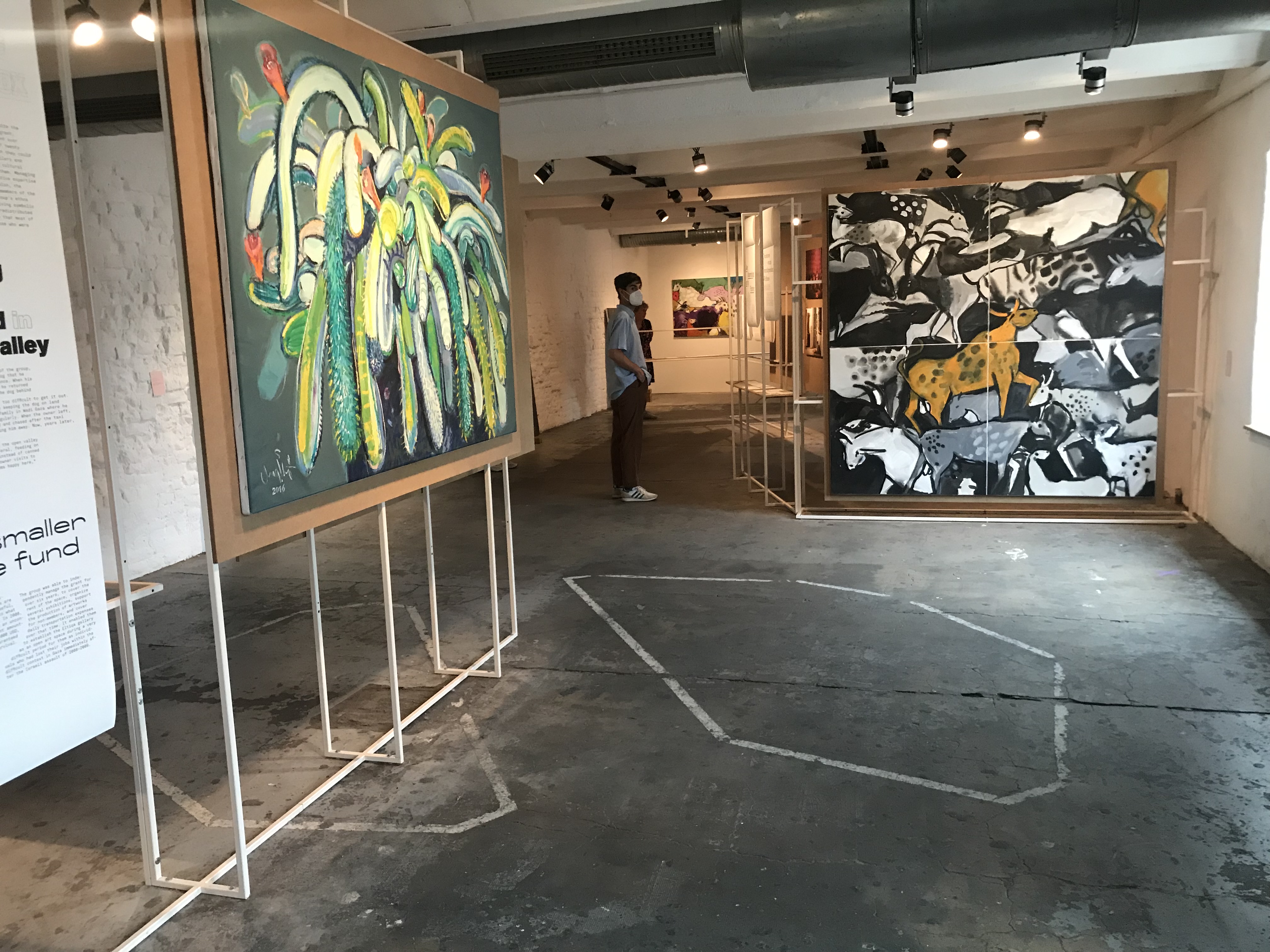 installation shot with two paintings