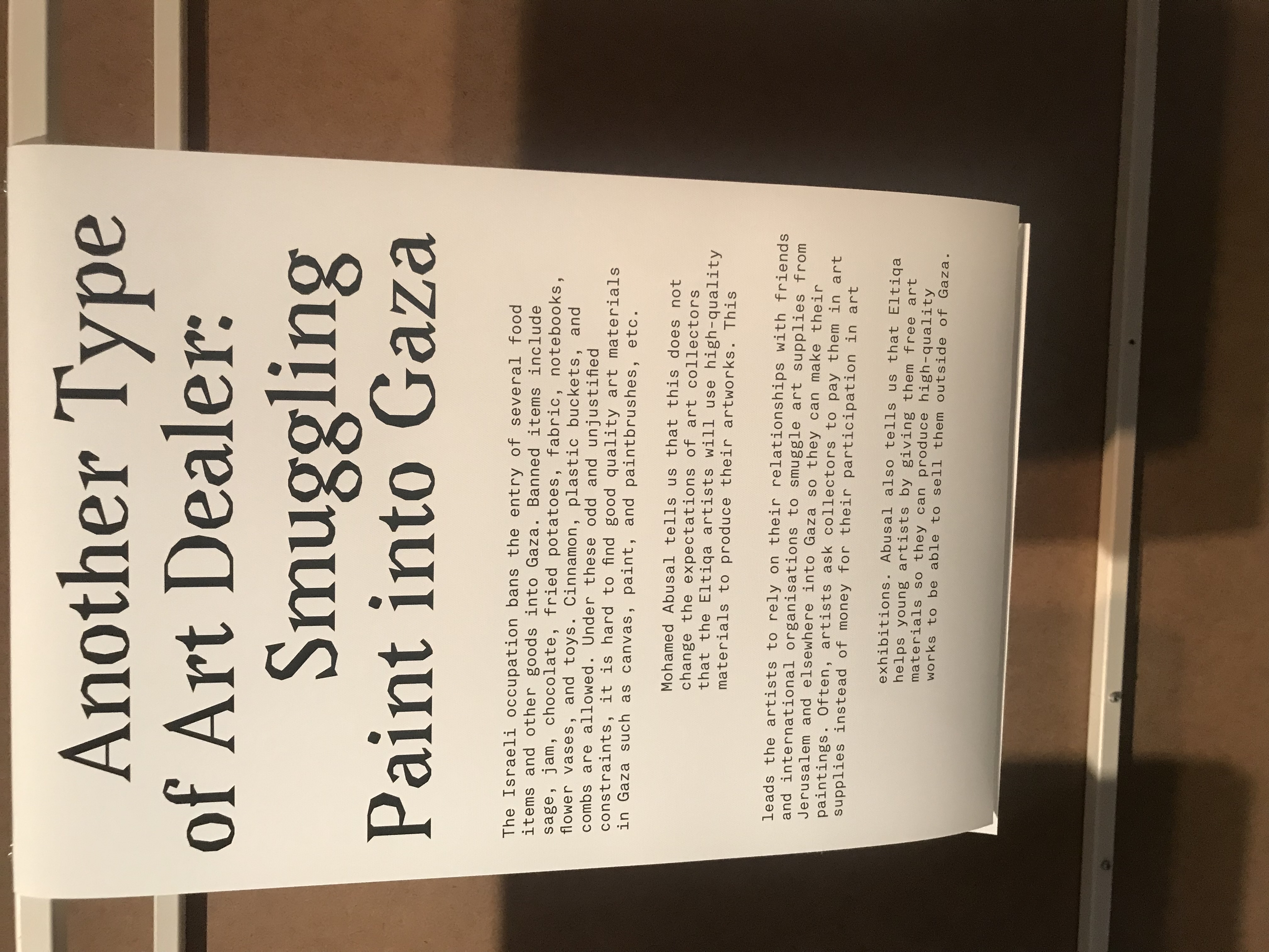 Wall text: 'Another type of art dealer: smuggling paint into Gaza